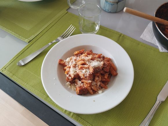 Serve with a spray of olive oil, some grated parmesan and basil on top.